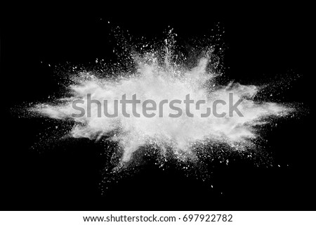 Freeze motion of white powder explosion on black background.r, White color glitter texture on black background. Royalty-Free Stock Photo #697922782