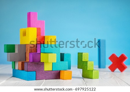 Colorful constructor, logic game, cubic mosaic. Design created by cubes. The concept of logical thinking, geometric shapes. Royalty-Free Stock Photo #697925122
