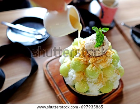 Closeup Melon is a Korean shaved ice dessert with sweet toppings such as ice cream vanilla, whipped cream and sweetened condensed milk. It's very popular dessert.