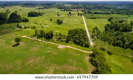 drone image. aerial view of rural area with freshly cultivated fields. green and brown. summer - panoramic image
