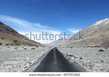 on the road , mountain and sky , india
