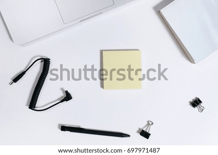 Creative minimal layout of mobile phone, laptop, headphone, clip, post it, clips and pen. Flat lay, top view, copy space. minimal concept. simple layout background.