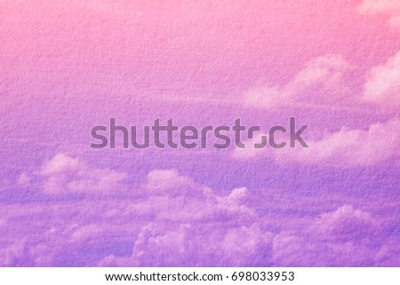 Double exposure of cloud and sky of paper texture for background Abstract,postcard nature art pastel style,soft and blur focus.
