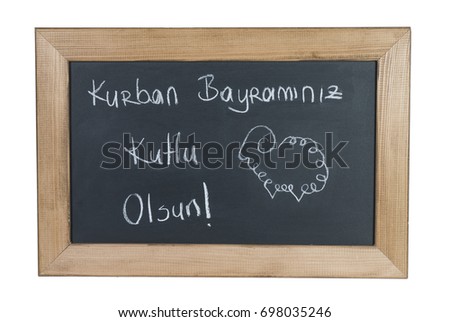 Sheep Drawing on Black Board for Feast of Sacrifice and written "Kurban Bayram?n?z Kutlu Olsun" on it