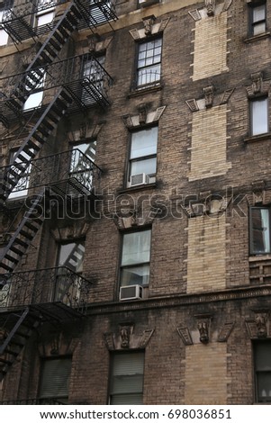 Wall of the house with fire stairs in downtown New York