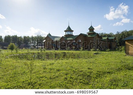 Big old Russian wooden house in a Sunny summer day.