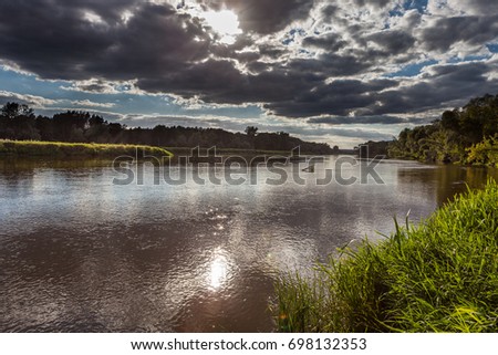 Landscape - storm clouds over the river