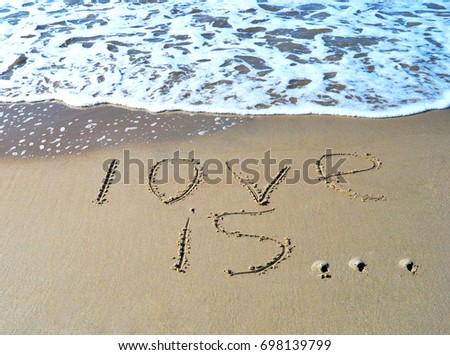 The word love is on the beach background
