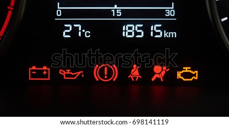 Car dashboard icons close-up. Error vehicle signs