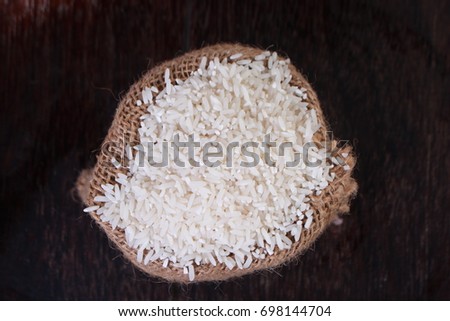 Photo image. Food photography. Raw uncooked white rice cereal grain background. Asian main carbohydrate source