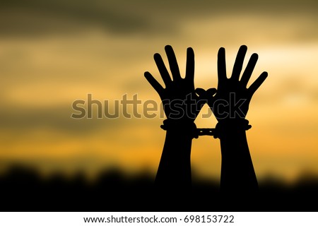 Silhouette man chained to a lack of freedom. Royalty-Free Stock Photo #698153722