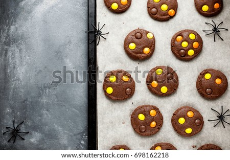 Halloween chocolate cookies with orange and yellow candy
