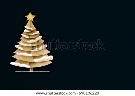 xmas greeting card with pine tree paper cut on dark blue color background