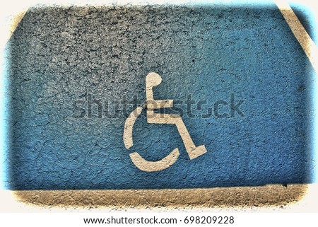 Parking for disabled people in Tel Aviv. Asphalt painted parking lot sign for people with wheelchair in Israel. Vintage style toned picture