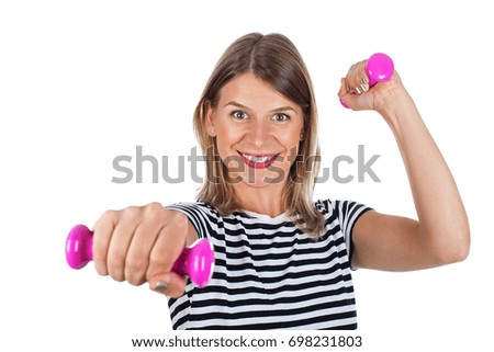 Picture of a smiling young woman holding pink dumbbells posing on isolated background