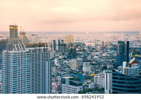 Business district at Bangkok city with after storm at sunset ,Top view of metropolitan area
