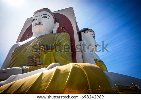 Illuminating Sunlight, Kyaik Pun Buddha the Four Seated Buddha Shrine Sitting Back to Back of Four Directions, Bago (Pegu), Myanmar. 
