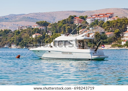 Scenic picture of a white yacht on the adriatic sea, dalmatian coast in Trogir, Croatia