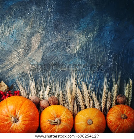 Basket with fresh apples and pears on a wooden table. Autumn background.