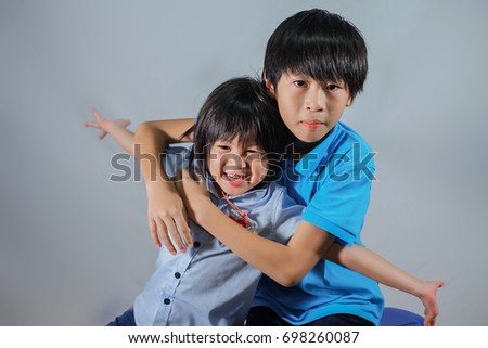 Brothers play and fun.Cute boy play with his brother.