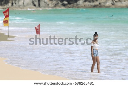 Asian girl by the sea in phuket beach.