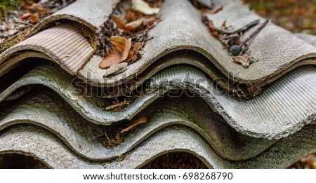 Old and dangerous asbestos roof Royalty-Free Stock Photo #698268790