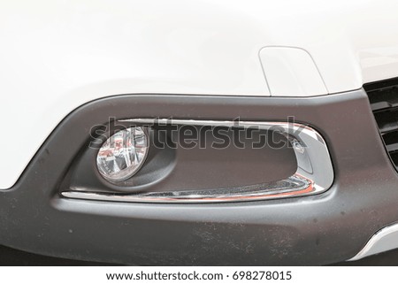 type headlights of the vehicle, note shallow depth of field