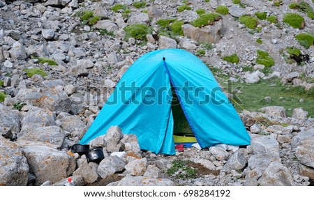 Blue tent in the mountains