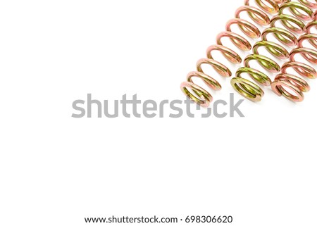 Top view of three spring steel Rainbow colors isolated at right of picture on a white background.