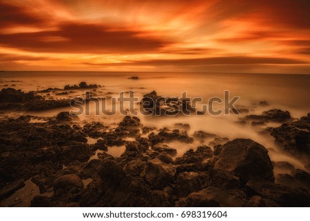 Long exposure photography: View of sunrise in Punta Mujeres beach, Lanzarote, Canary Islands, Spain