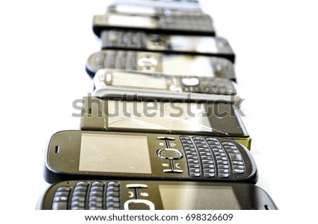 Old mobile phones isolated on white background