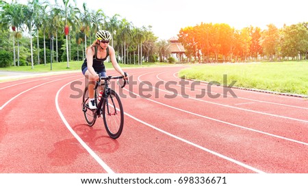 Attractive girl in a sports bike,exercise, Sport's concept.
