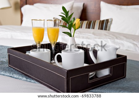 Breakfast tray on a bed Royalty-Free Stock Photo #69833788