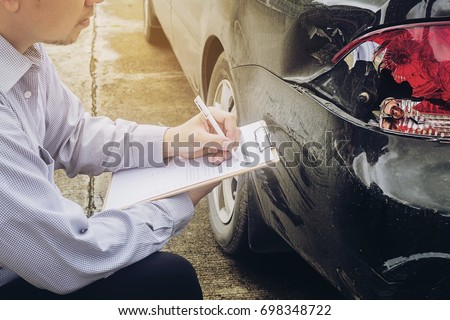 Insurance agent working on car accident claim process