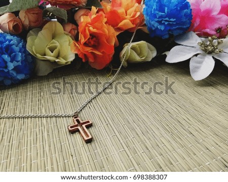 Christian Cross necklace with colorful flowers, copy space