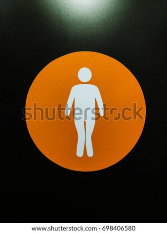 male toilet symbol at black background 