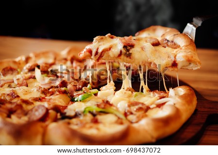 Slice of pizza cheese crust seafood topping sauce. with bell pepper vegetables delicious tasty fast food italian traditional and soft drink carbonated fresh on wooden board table classic and smoke