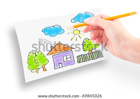 Woman's hand with the pencil and brushes drawing the dream home on a white sheet of paper