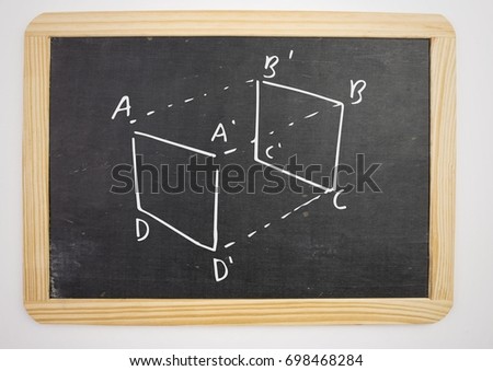Digital composite of geometry cube measurement diagram on blackboard