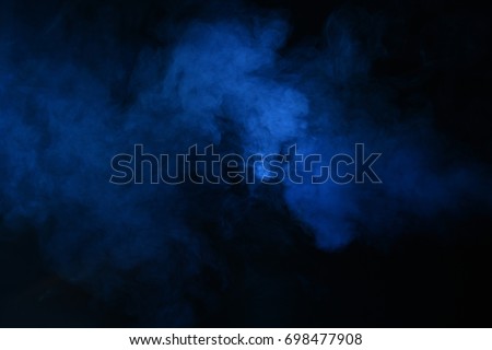 Abstract blue smoke on a dark background. Blue smoke background
