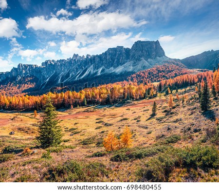 Splendid sunny view of Dolomite Alps. Colorful autumn scene of Ponta dei Lastoi mountain range. Giau pass location, Italy, Europe. Beauty of nature concept background.
