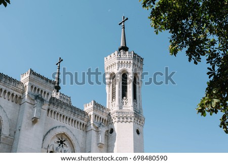 Basilica Notre-Dame de Fourvière with a moon on the background in the sky, Lyon, France