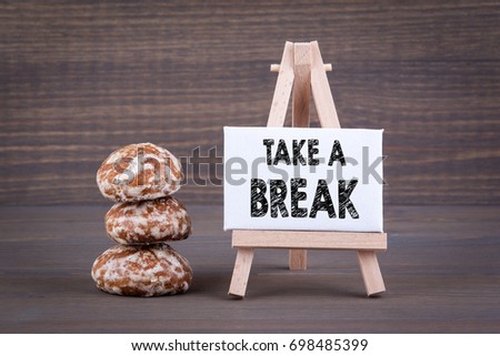 Take a break. Biscuits with sweet filling on a wooden background