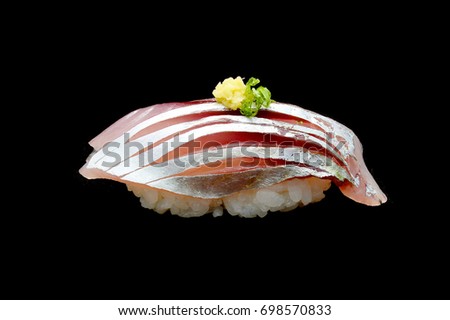 Aji Sushi or raw  horse mackerel fish on Japanese rice.Japanese tradition food with black isolated background 