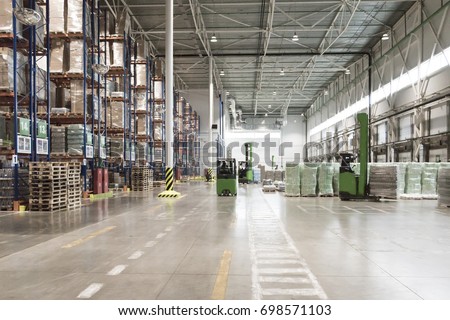 Typical storage, warehouse interior. Selective focus. Royalty-Free Stock Photo #698571103