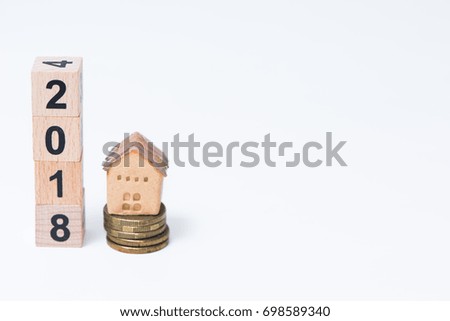 The wooden cube for new year the house model on white background