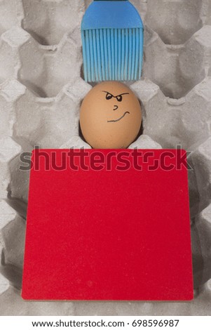 Cartoon face expression at egg and red board with finger also plastic brush