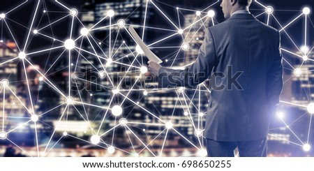 Close of businessman holding papers in hand and connection lines at background