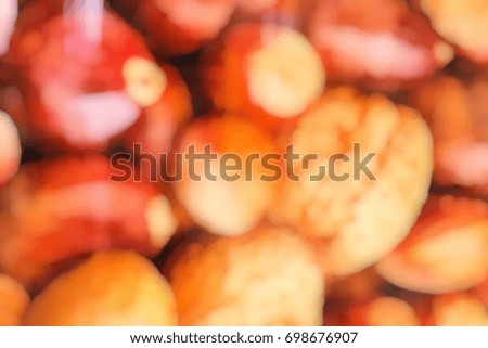Blurred image of nuts and chestnuts.
