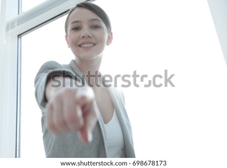 happy business woman pointing forward
